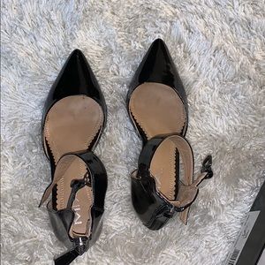 Black patent leather pumps